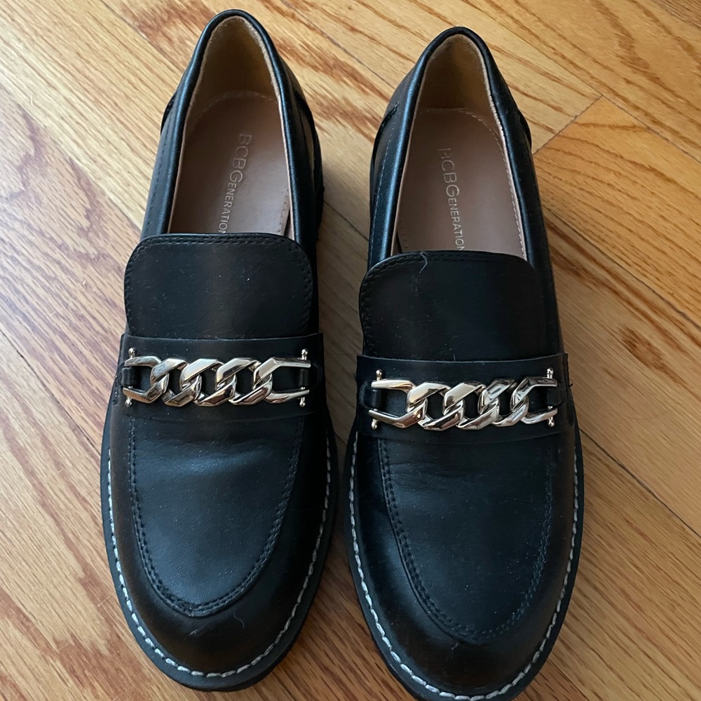 BCBGeneration black loafers with gold detailing
